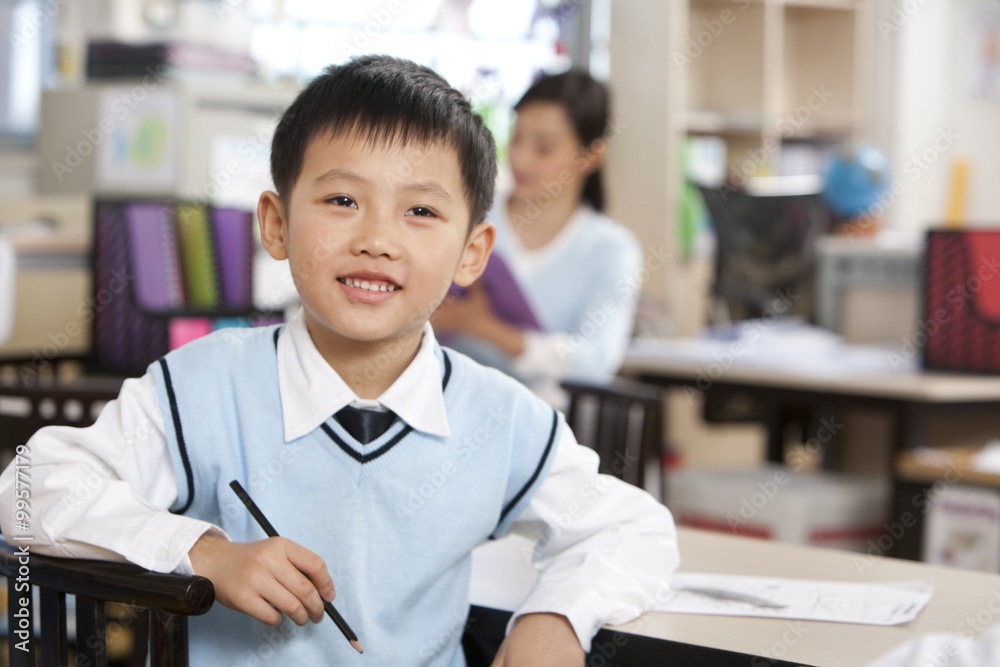Young student smiling in class