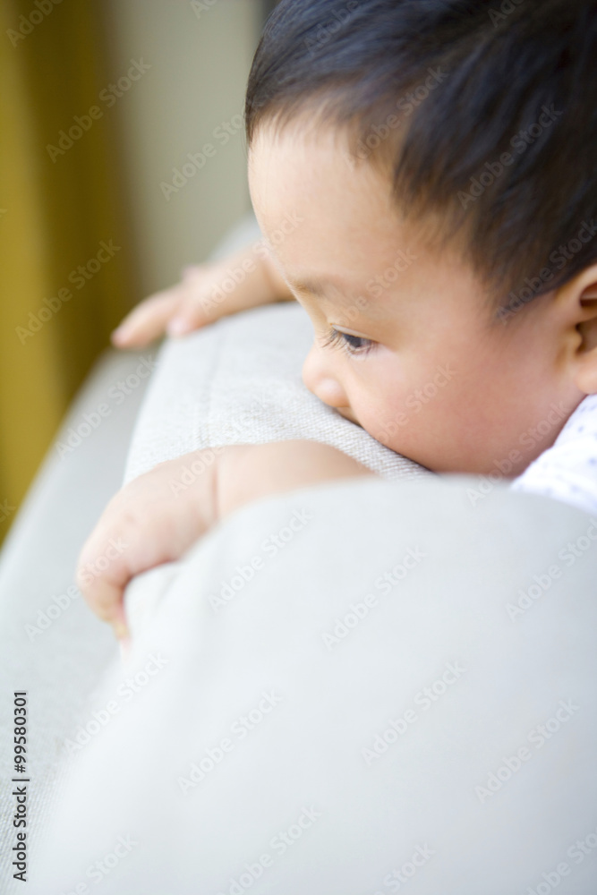 Infant on sofa back
