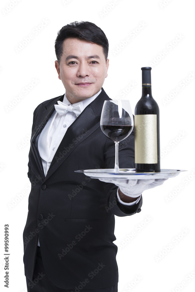Waiter serving wine