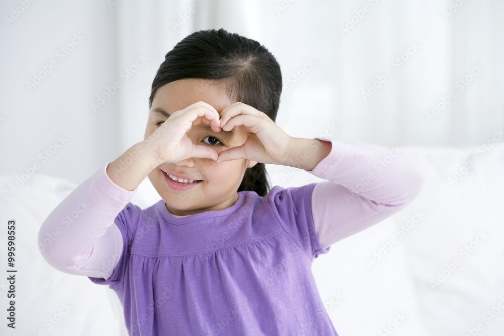 Chinese girl hands in heart shape