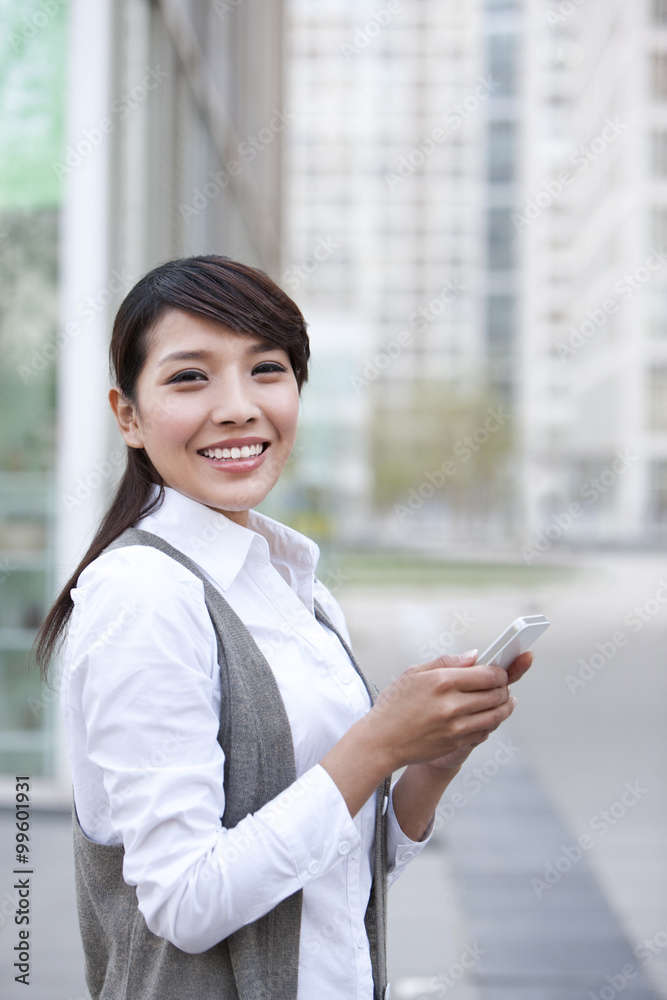 Young businesswoman and cellphone