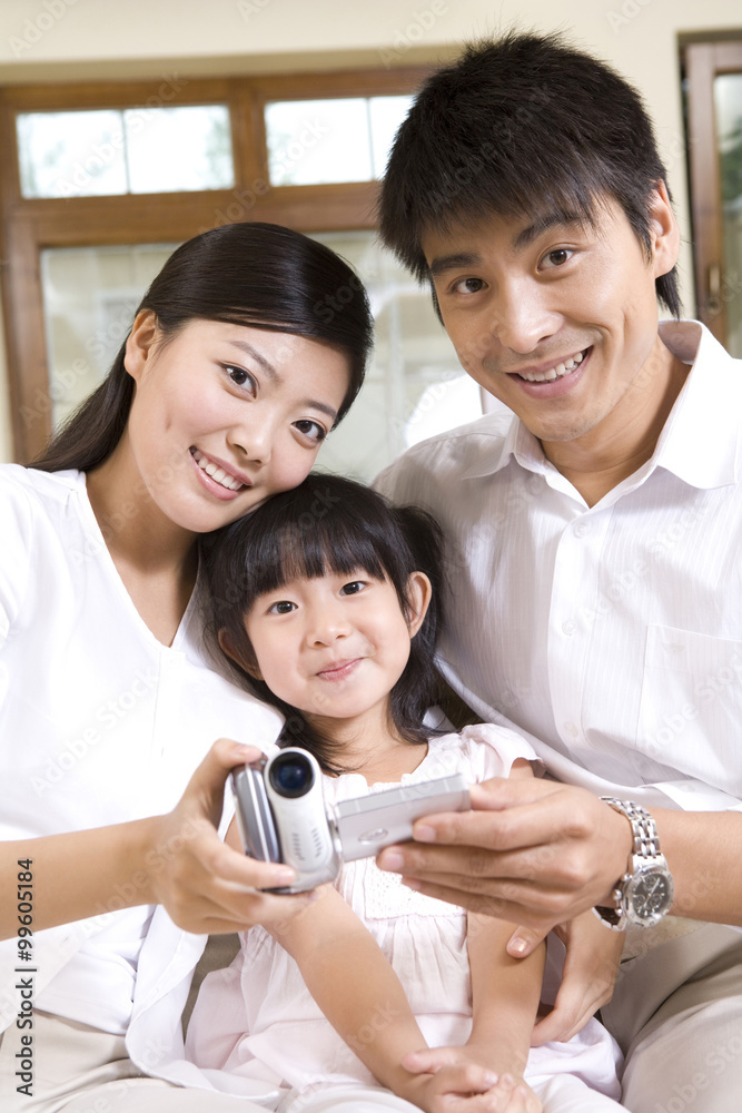 Family using digital video camera