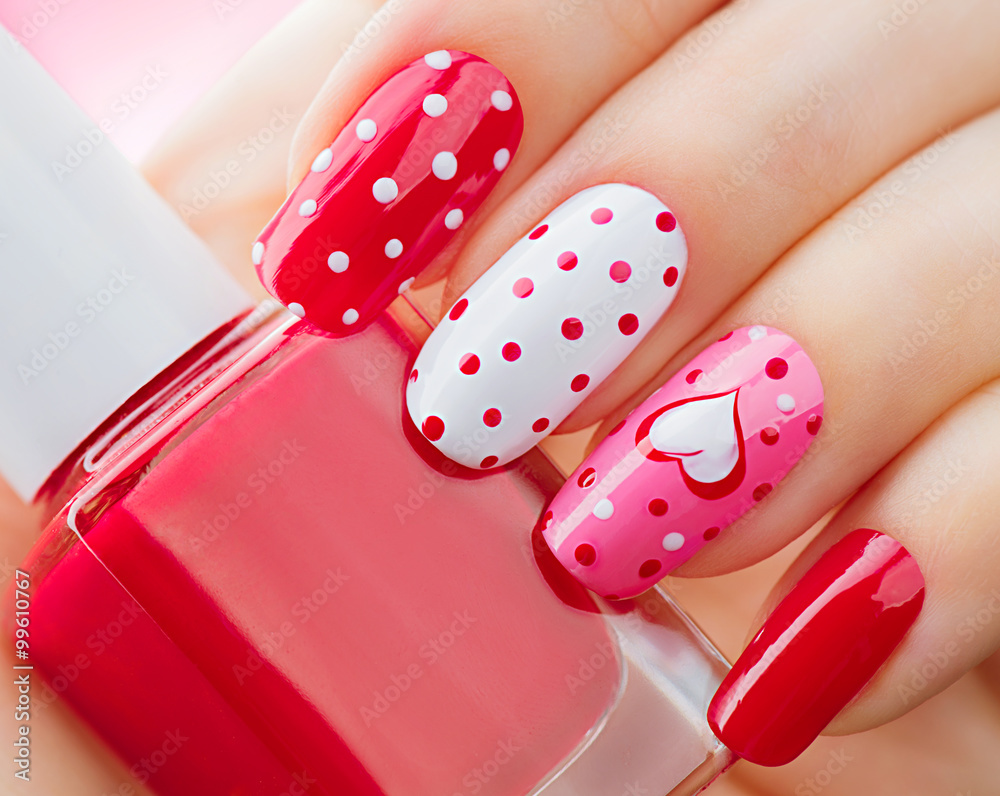 Valentines Day holiday style bright manicure with painted hearts and polka dots
