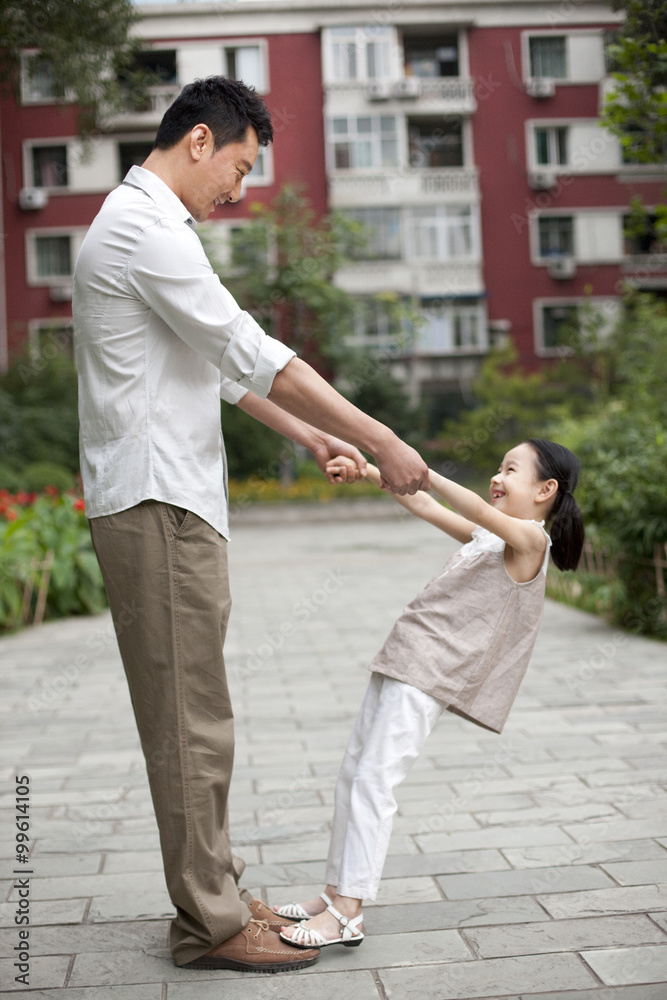 Chinese father and daughter playing