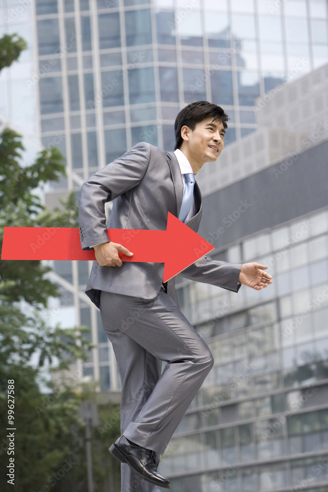 Chinese businessman with a red arrow