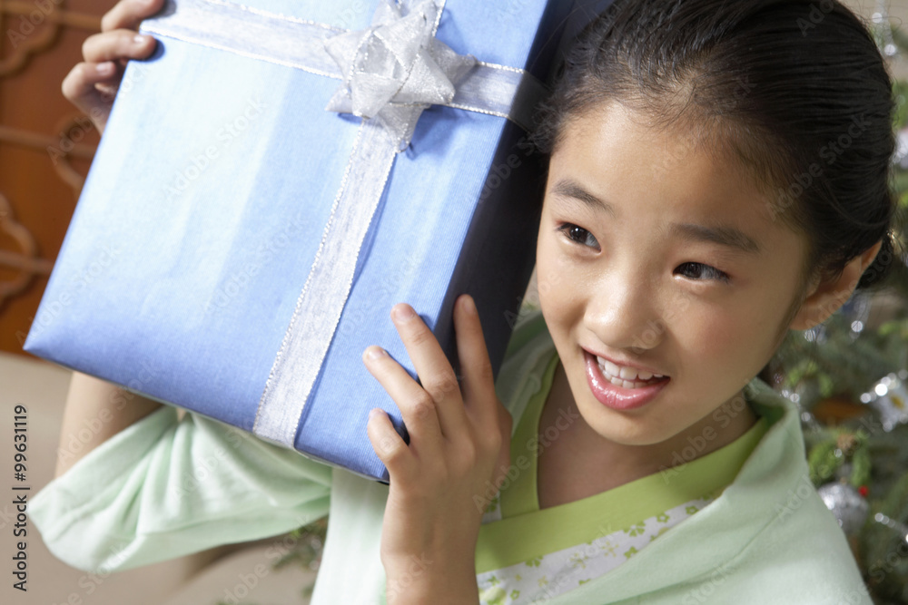Young Girl Getting Excited About Christmas Presents