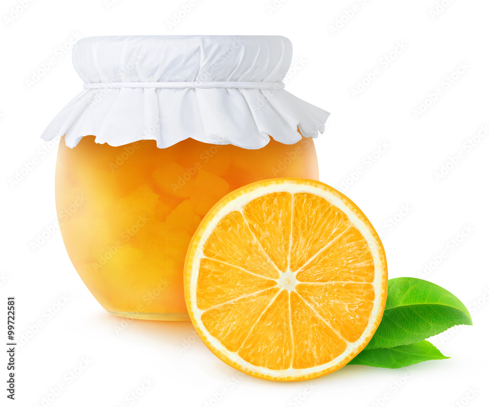 Orange jam in a jar and half of orange