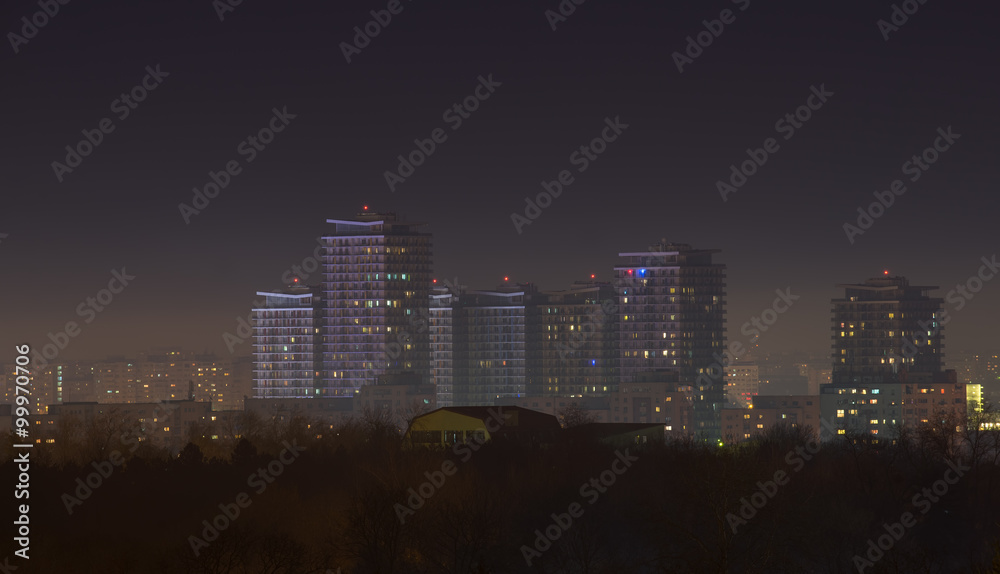 Bucharest city skyline at night with skyscrapers