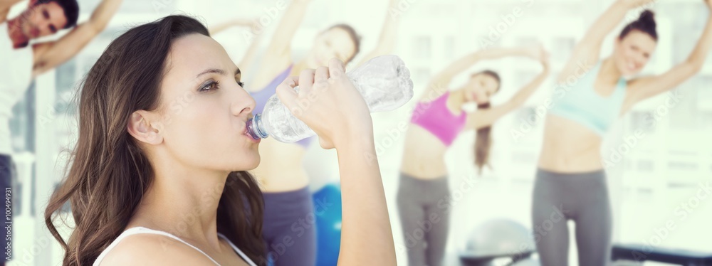 Beautiful woman drinking water from bottle