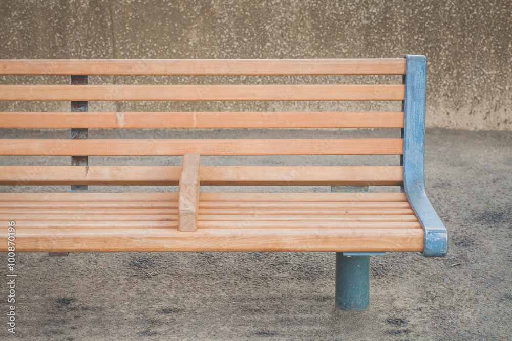 Outdoor brown wood bench at public park area