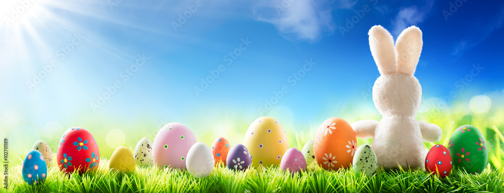 Bunny With Decorated Eggs On Sunny Meadow - Spring And Easter Background