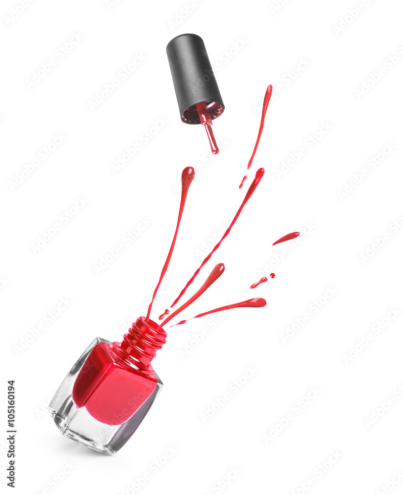 red nail polish bottle with splash isolated on white