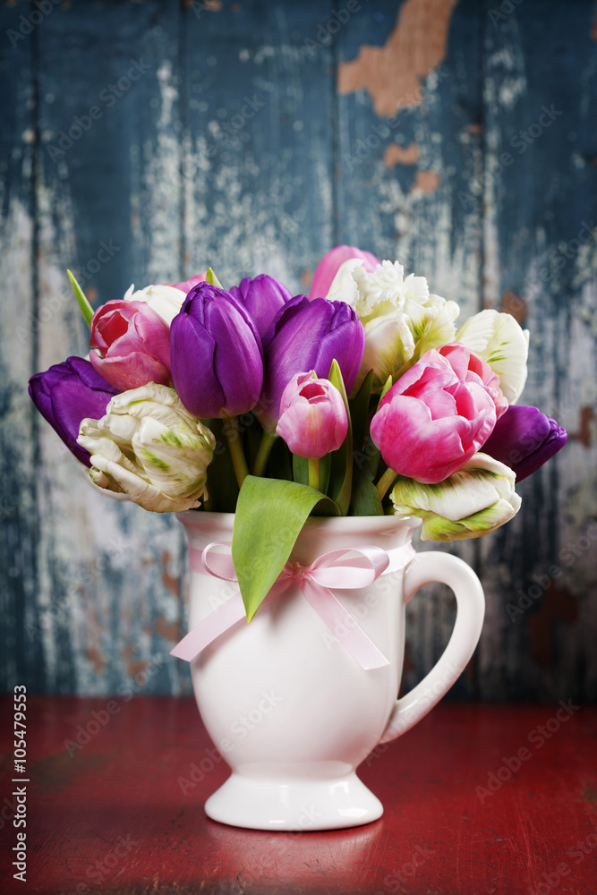Beautiful tulips bouquet  on wooden table