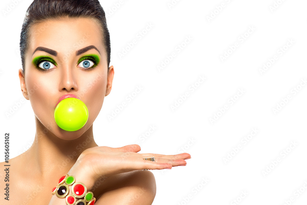 Fashion funny model girl with green bubble of chewing gum