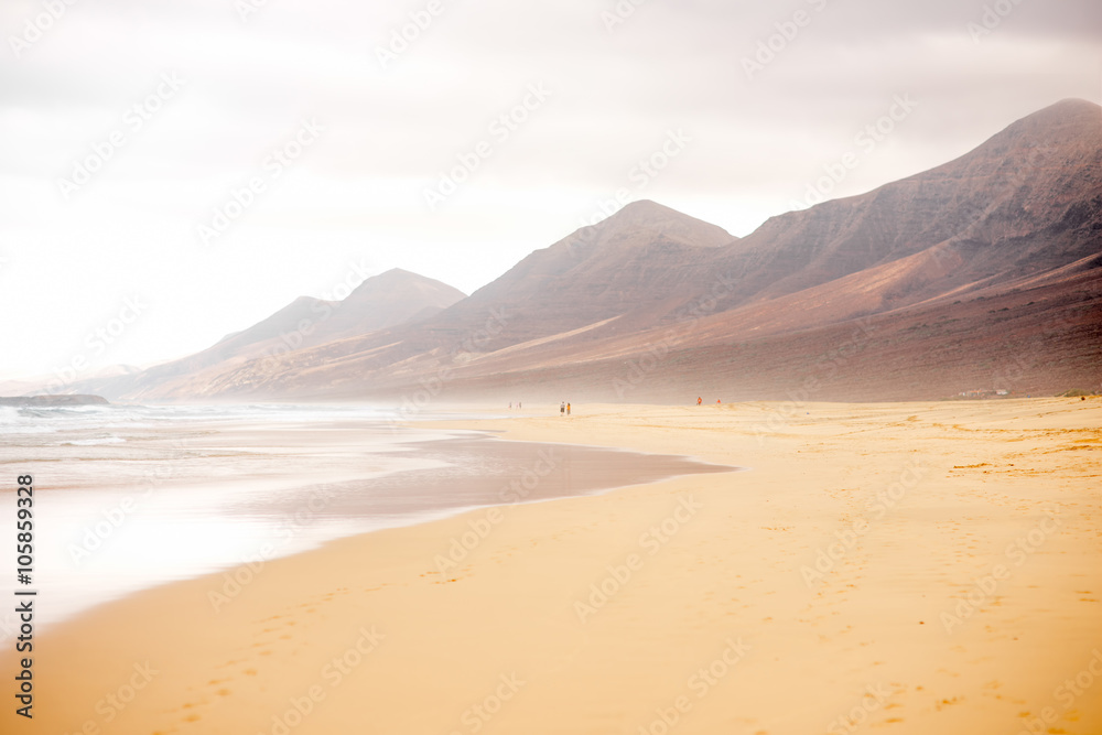 Cofete beach at the cloudy and foggy weather on Fuerteventura island in Spain