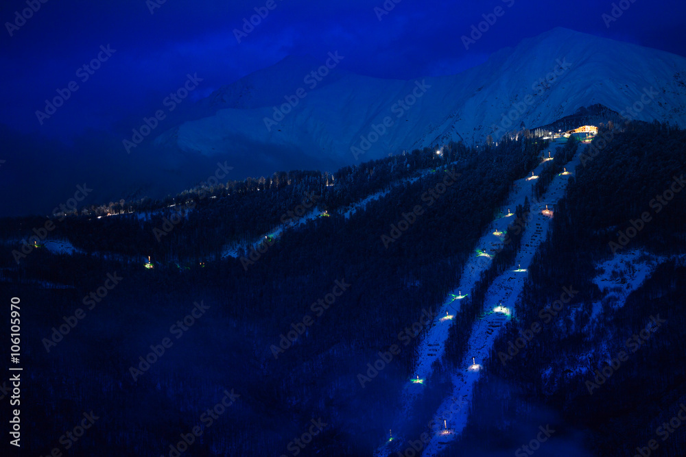 Night view of mountain with ski lift nd resort 