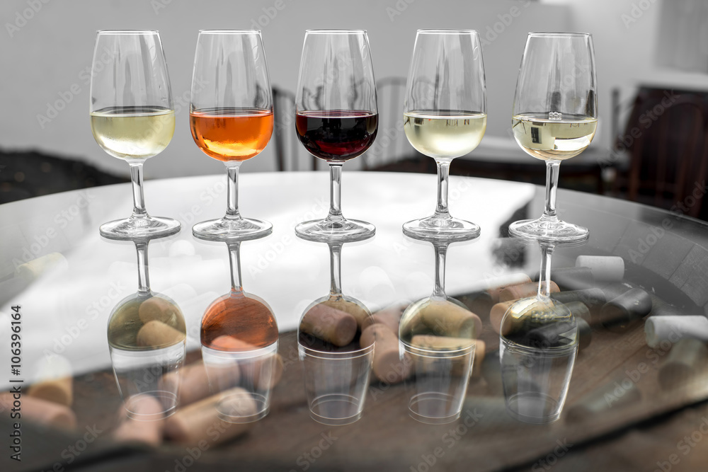 Set of six different wines in wineglasses on the table for degustation