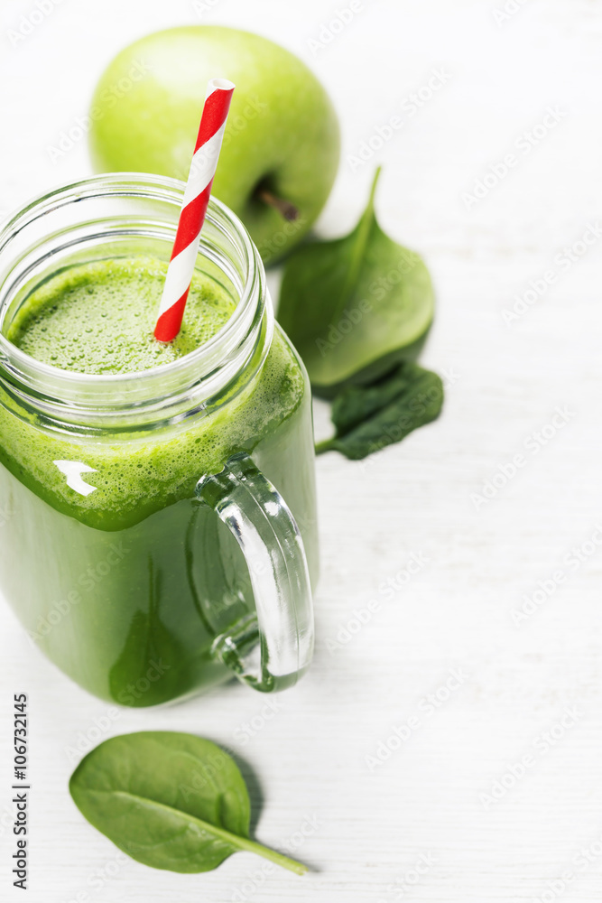 Healthy green smoothie and ingredients
