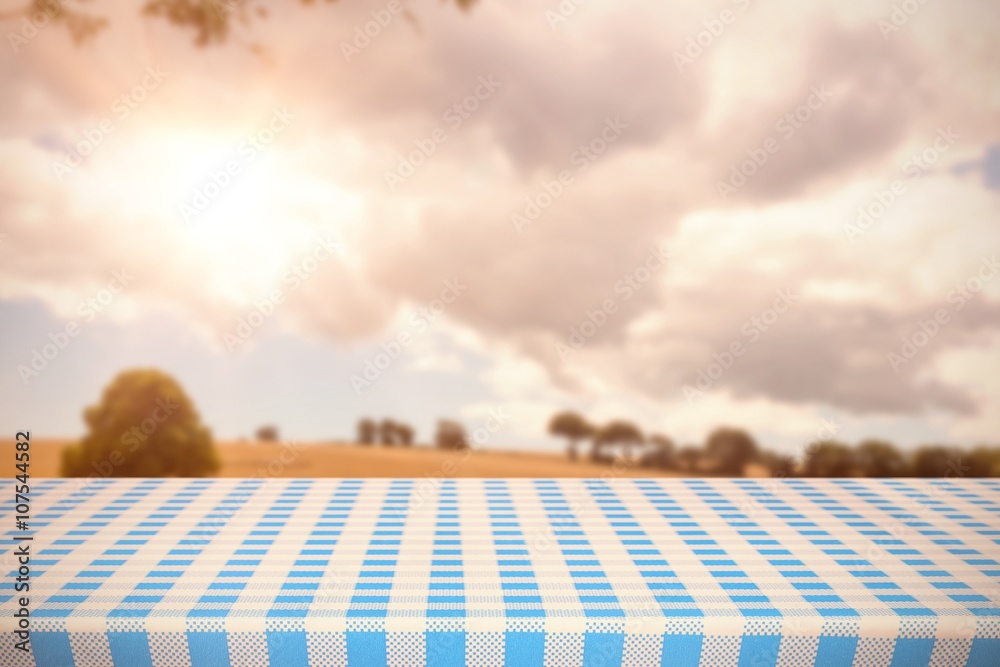 Composite image of part of blue and white tablecloth