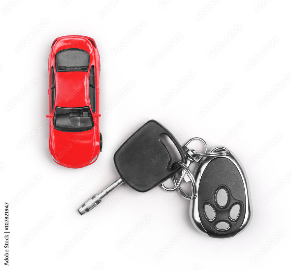 Toy car and keys isolated on white background