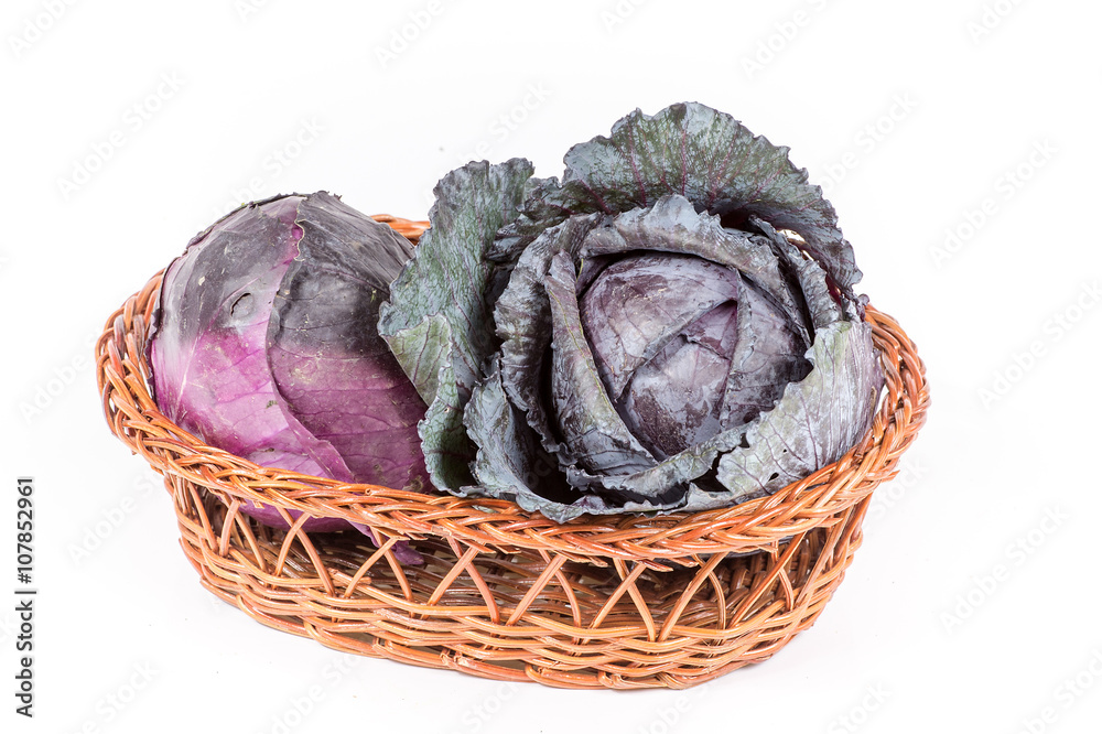 purple cabbage in a basket isolated on white background