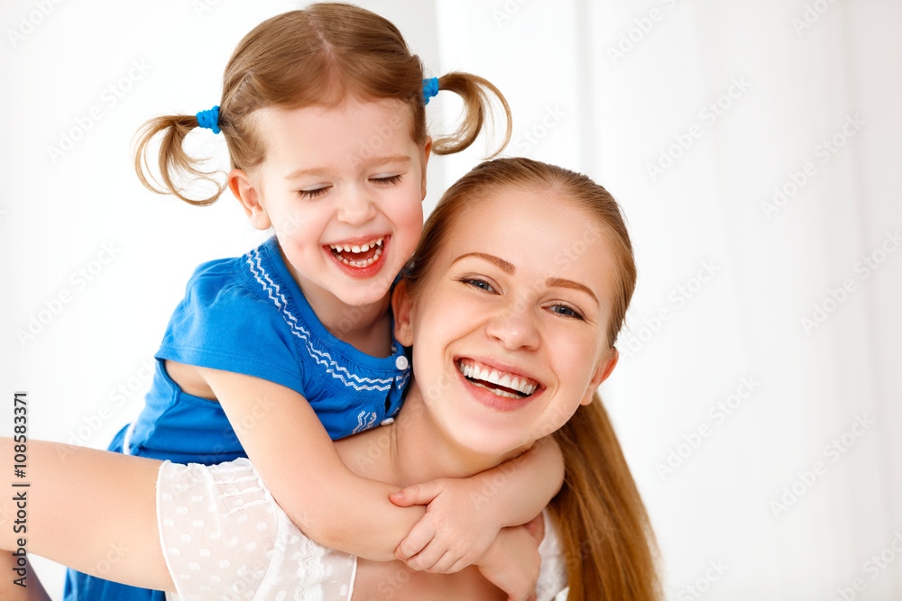 Happy loving family. mother and child laughing and hugging