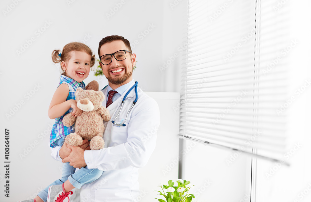 friendly happy male doctor pediatrician with patient child girl