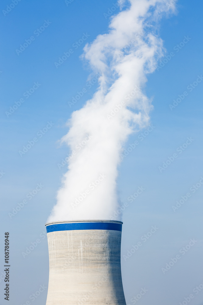 Industrial power plant smoke pollution in the blue sky