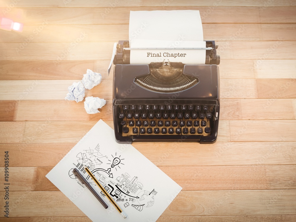 Final chapter against typewriter and paper on table in office