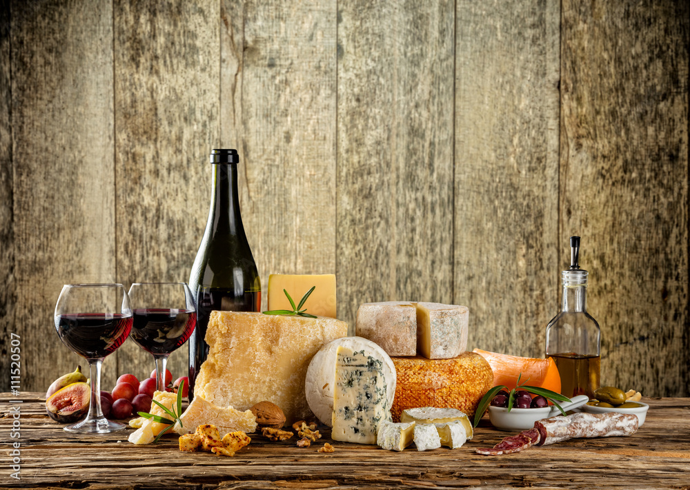 Various types of cheese with red wine