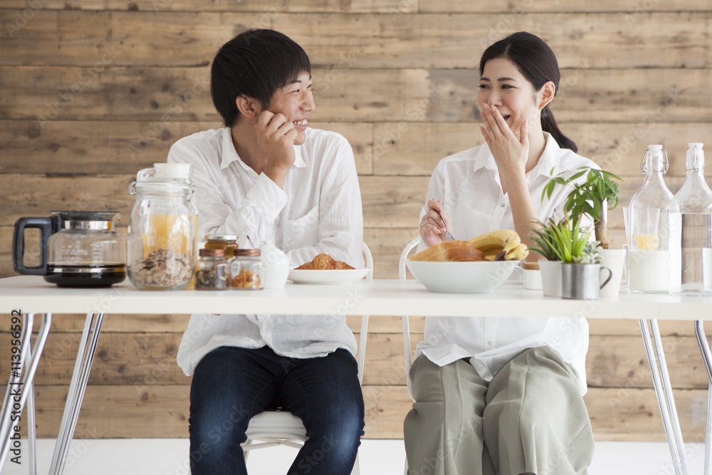 Newlywed couple is eating breakfast together