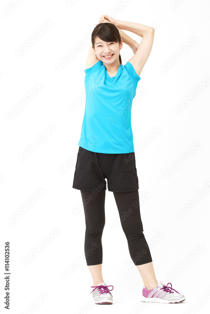 スポーツウェアを着た女性　ストレッチ