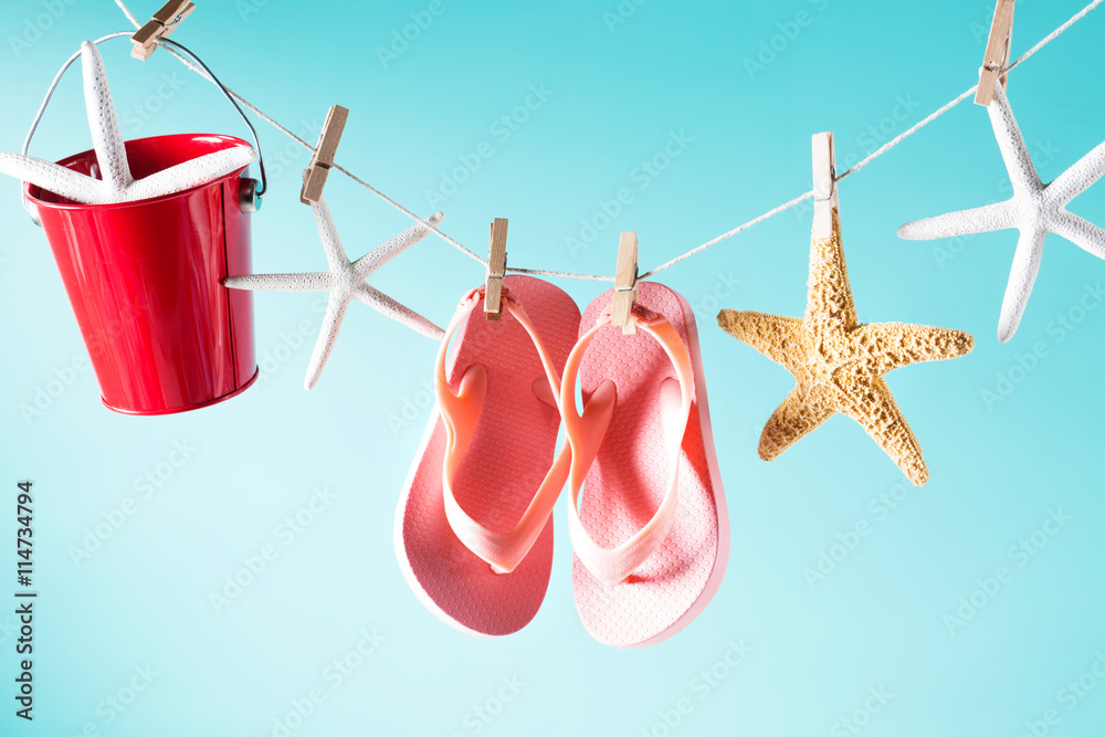 Summer theme with sandals, pail and starfish