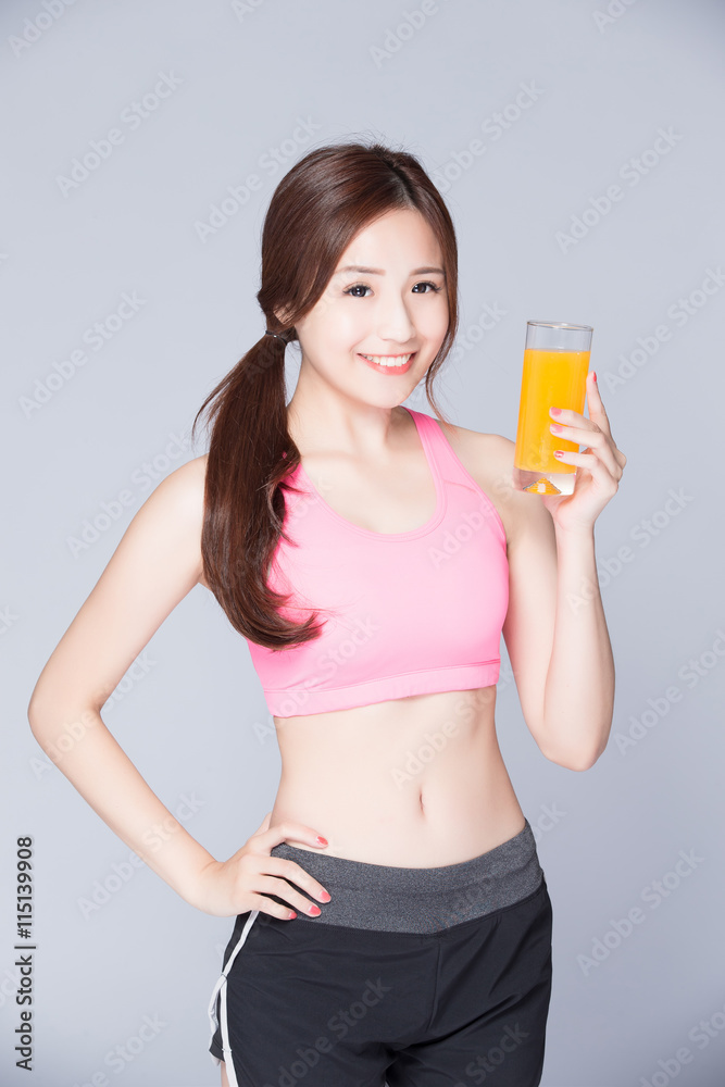 young girl drink orange juice