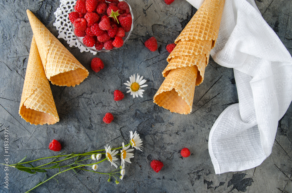 Ice Cream Cones. The process of preparation of raspberry ice cream. Raspberry on a dark stone table.