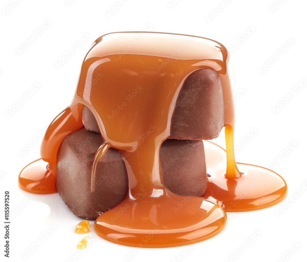 caramel sauce pouring on chocolate candies