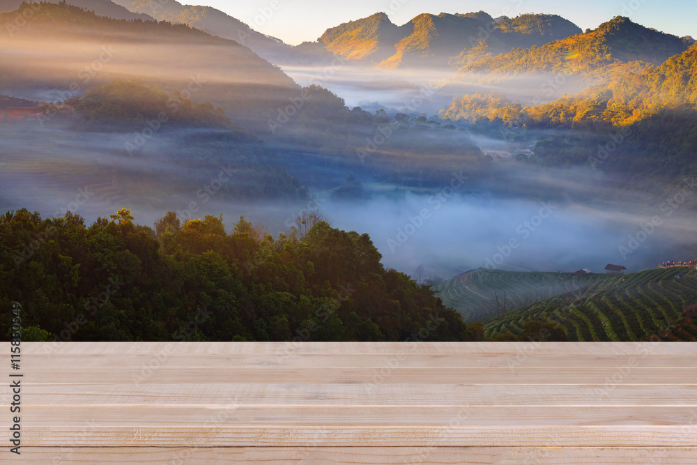 Wood table top on blurred tea plantation background - can be use