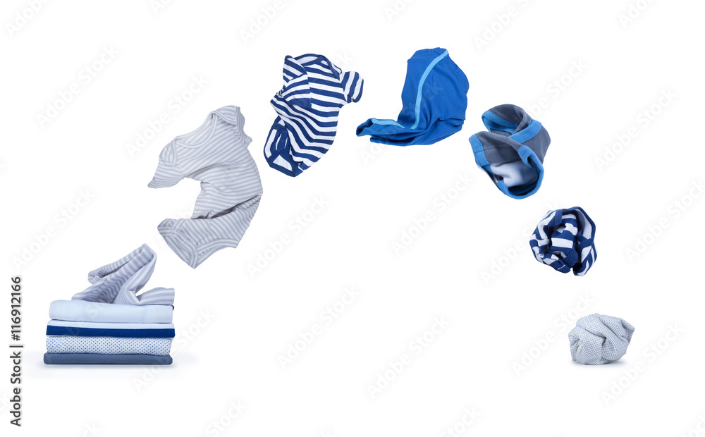 clothes fly out of pile and falls down isolated on white backgro
