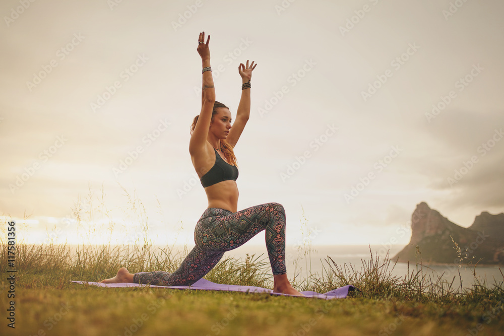 Muscular woman practicing yoga