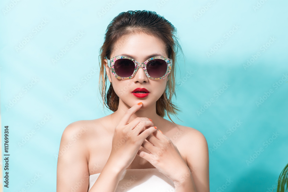 Colorful portrait of young attractive asian woman wearing sunglasses