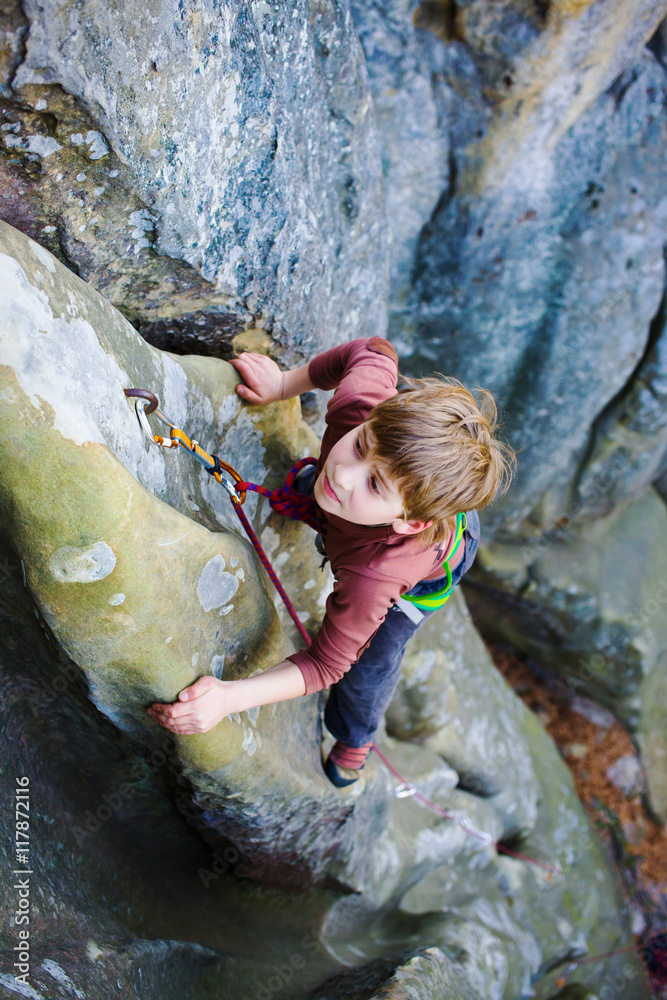 A bold child is climbing.