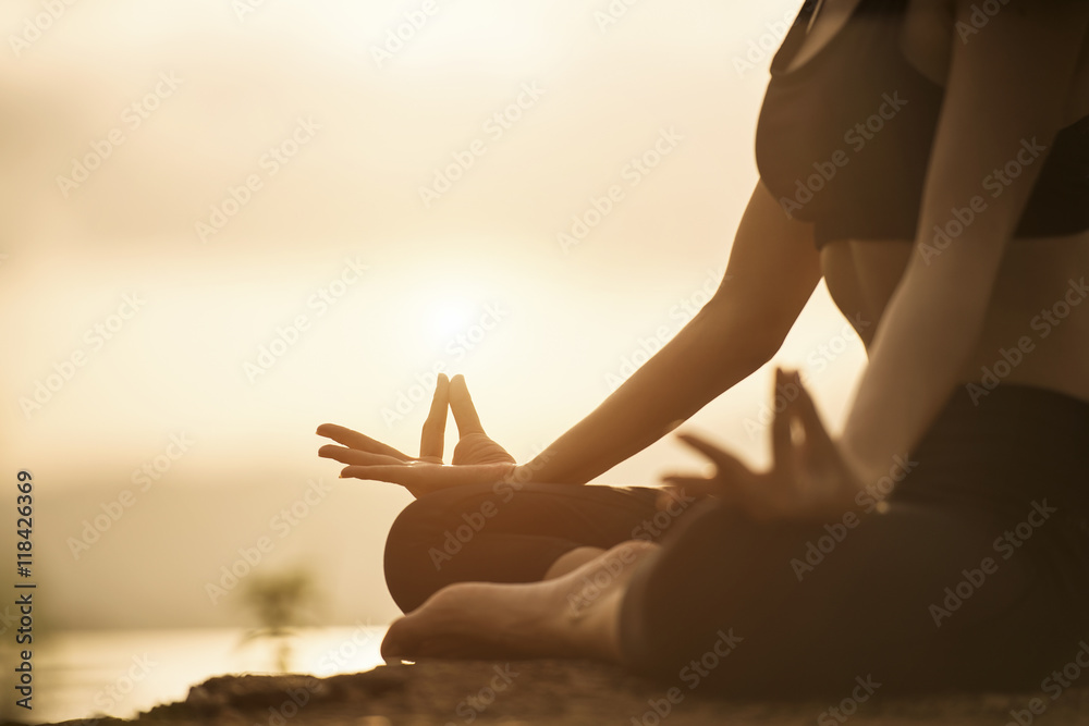 Serenity and yoga practicing at sunset, meditation