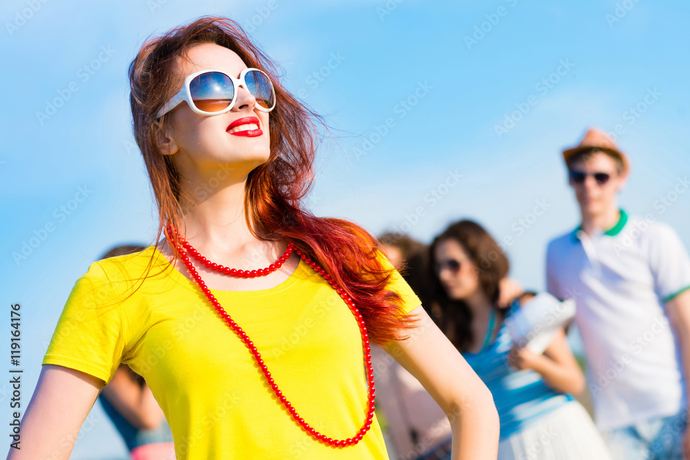 stylish young woman in sunglasses