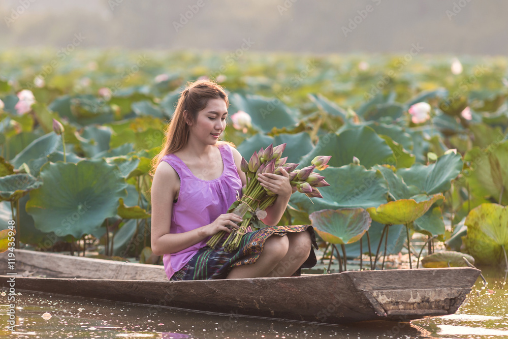 Rural girl with lotus in Thailand