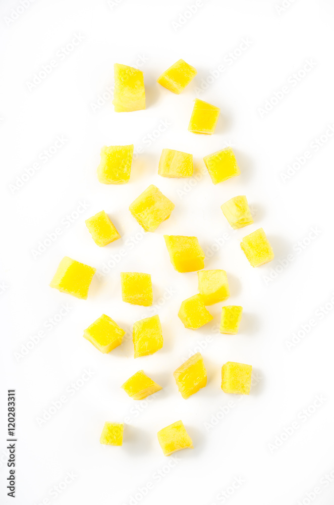 Mango slice cut to cubes isolated on white background. Top view.