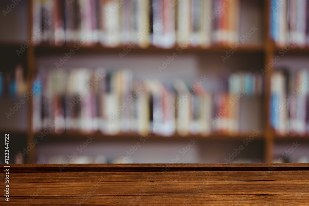 Wooden table with library background