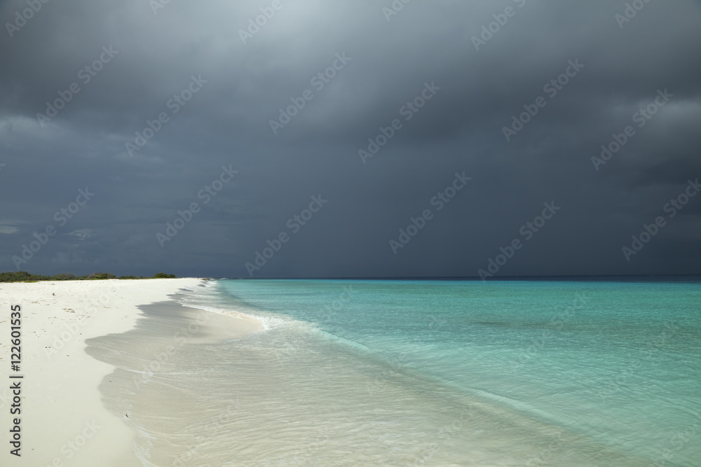 Tropical beach and strom clouds on Little Curaçao, Netherlands