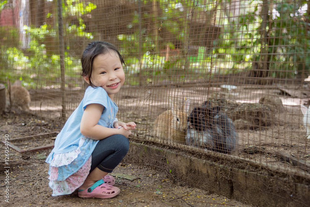 Little asian girl smiling in the zoo