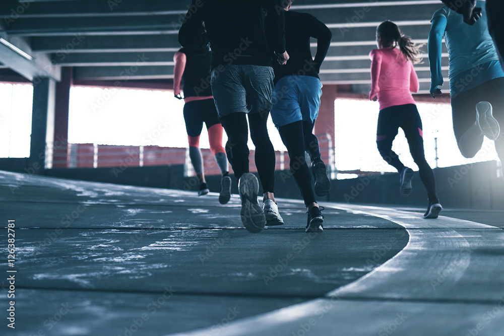 Sportsmen running together.