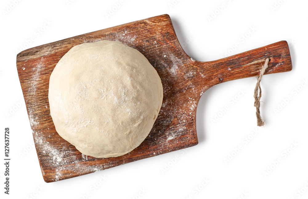 fresh raw dough on wooden board